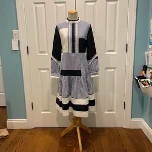 Blue and white color block and stripe dress with eyelet details.